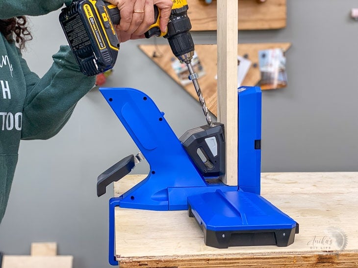 Woman drilling pocket holes using the Kreg 720