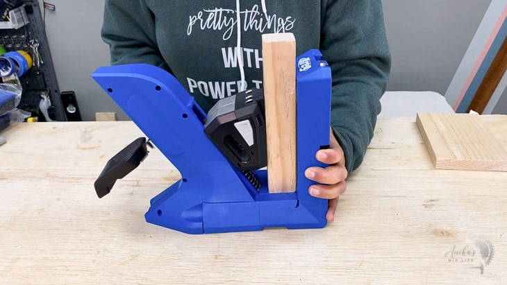 Woman clamping a 2x2 board in the Kreg 720
