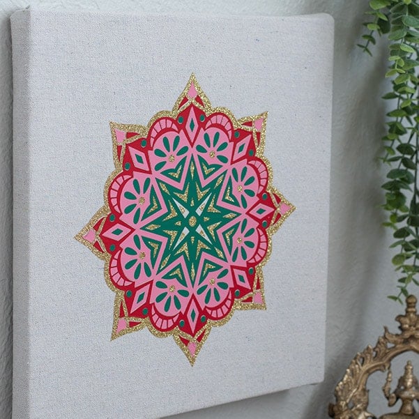 Make beautiful Indian-inspired living room decor with these simple DIY projects using a Cricut machine - a pillow, wall art and lamp! Bring the rich Indian textures and colors into your living room!