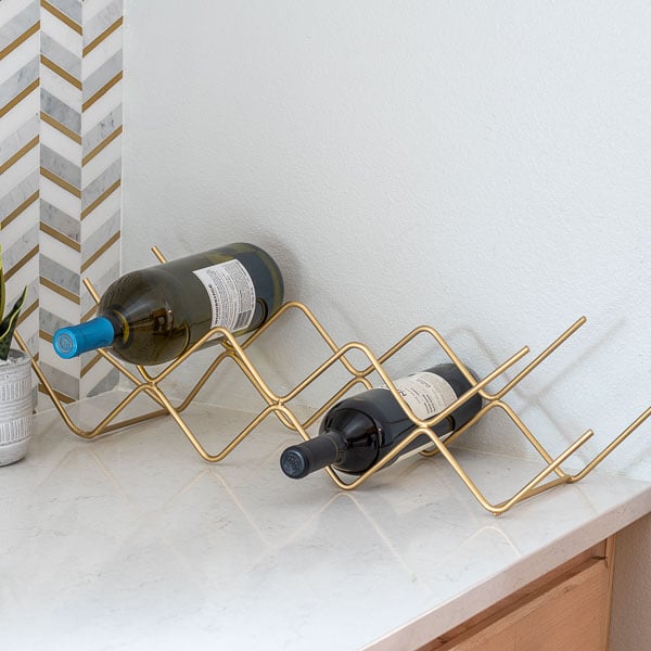 Learn how to make a tabletop DIY wine rack using steel rods - no welding needed!