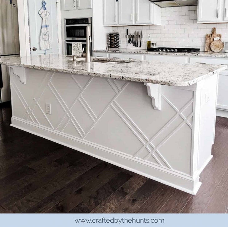 close up of white kitchen island update using trim in a geometric pattern.