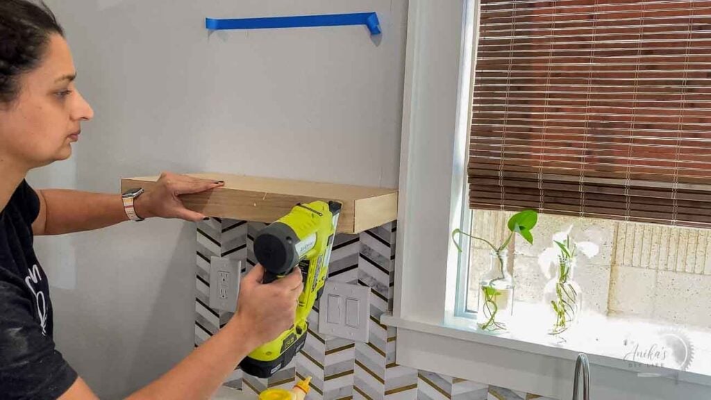 Attaching plywood to build a floating shelf in the kitchen