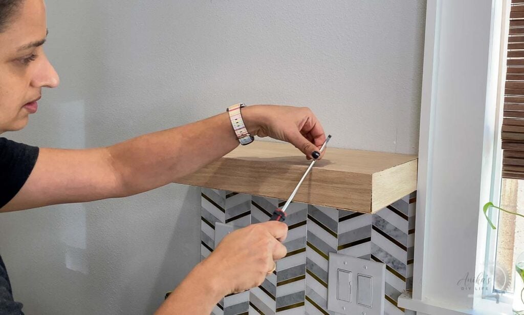 Rubbing screwdriver over seams to make them perfect