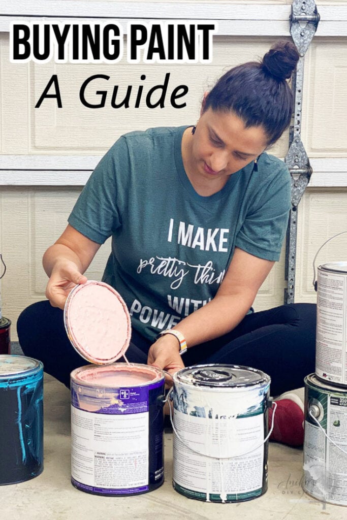woman opening paint cans on garage floor