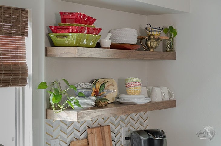 Long DIY floating shelves in a kitchen