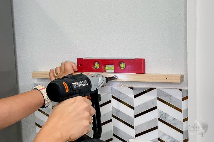 Installing toggle bolt by tightening with a power drill