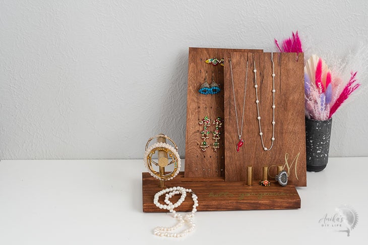 DIY Jewelry holder with jewelry on a table