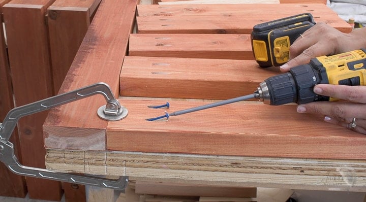 Attaching slats for the top of the Outdoor storage bench