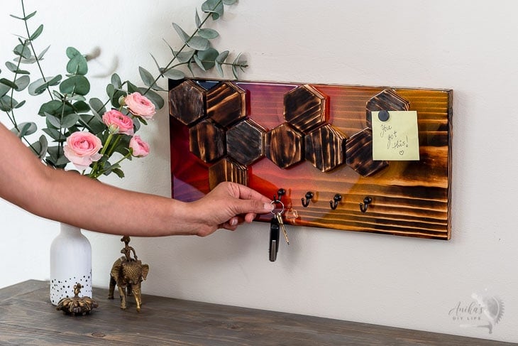 woman hanging keys on the keyholder