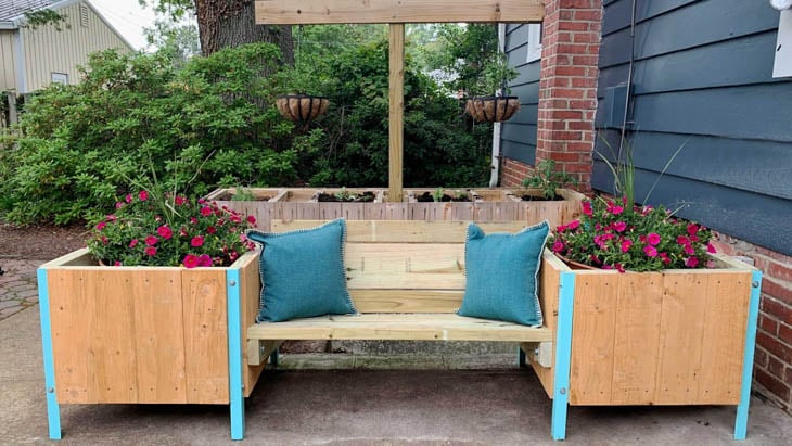 outdoor bench with raised wooden planer boxes attached to the ends