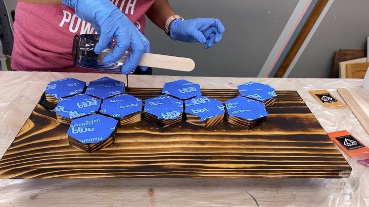 woman pouring epoxy on the keyholder