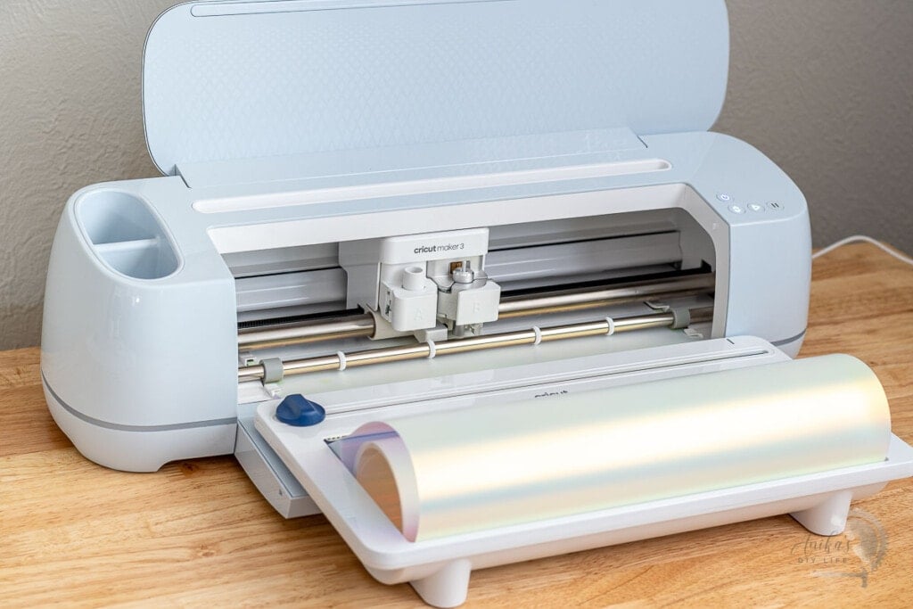 Cricut Maker 3 cutting holographic iron-on using a roll holder