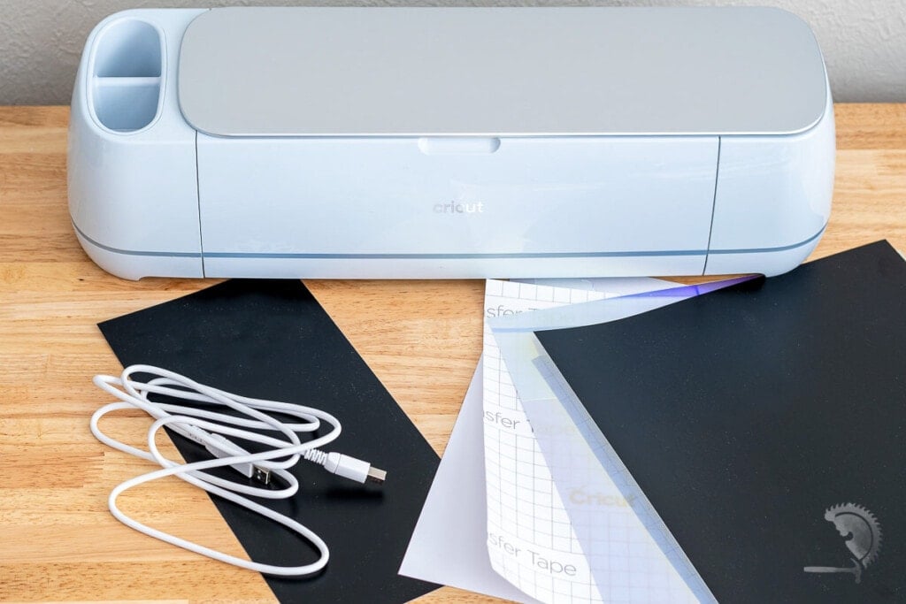Cricut Maker and all the items that come in the package - wire, sample sheets