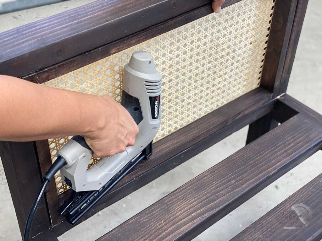 Attaching the cane webbing frame to the chair with finish nailer