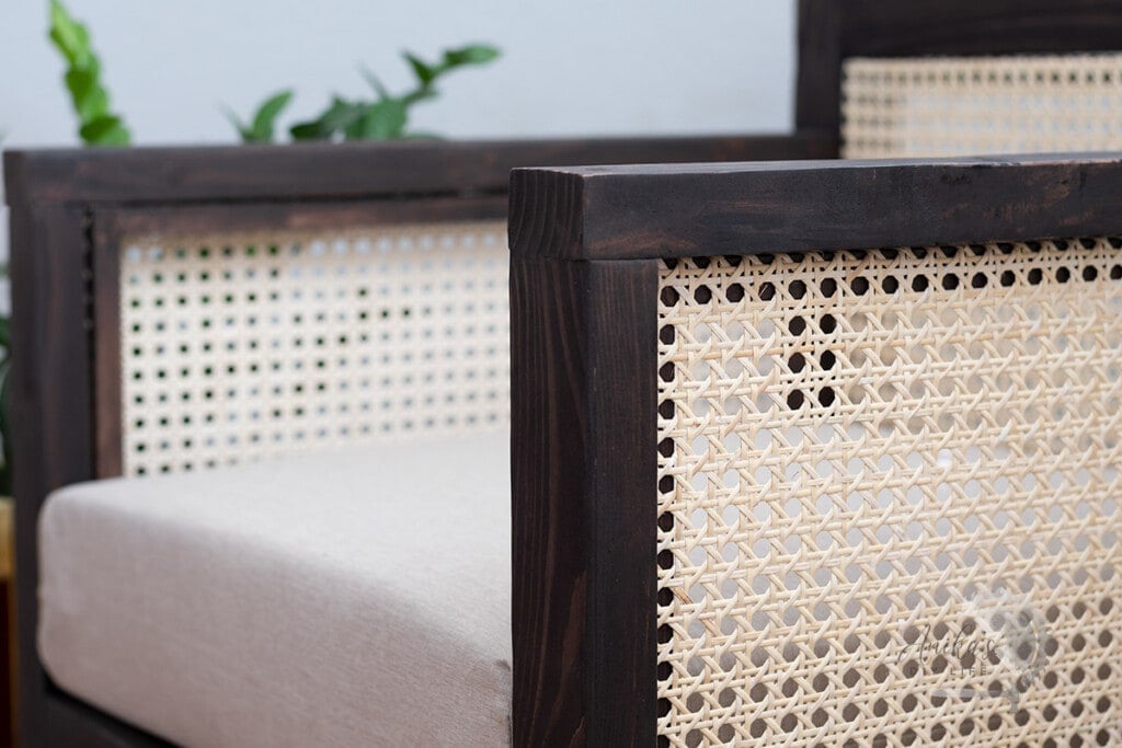 close up of the cane webbing in the arm of the chair