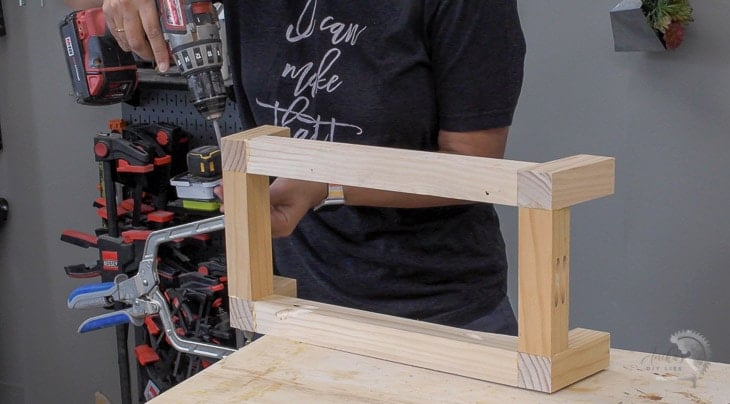Woman building angled legs using 2x2 boards