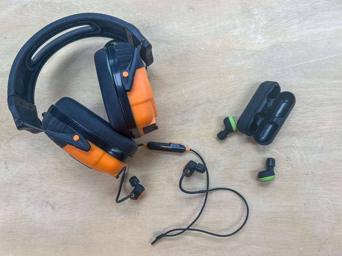 three types of hearing protection for woodworking on a workbench
