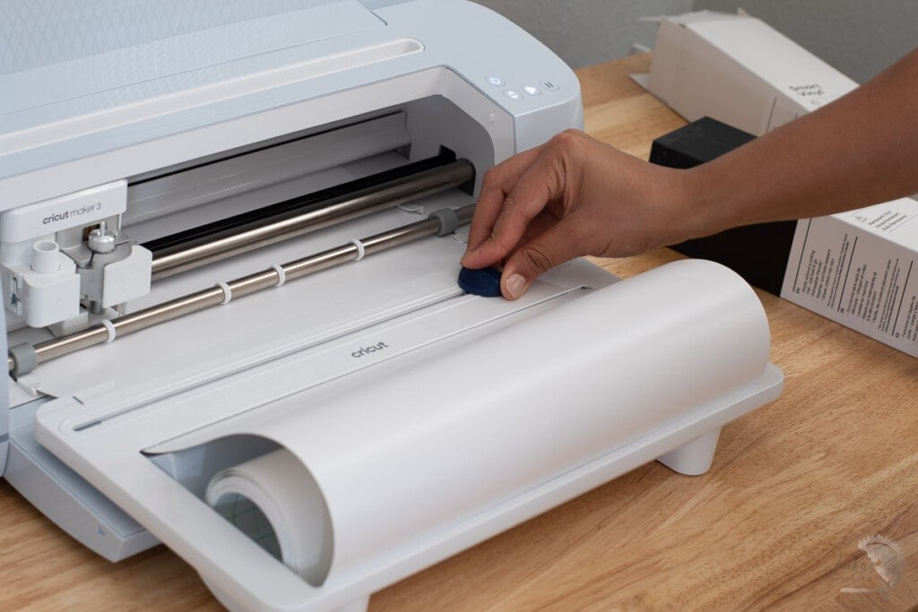 Woman cutting a vinyl on the Cricut Maker 3
