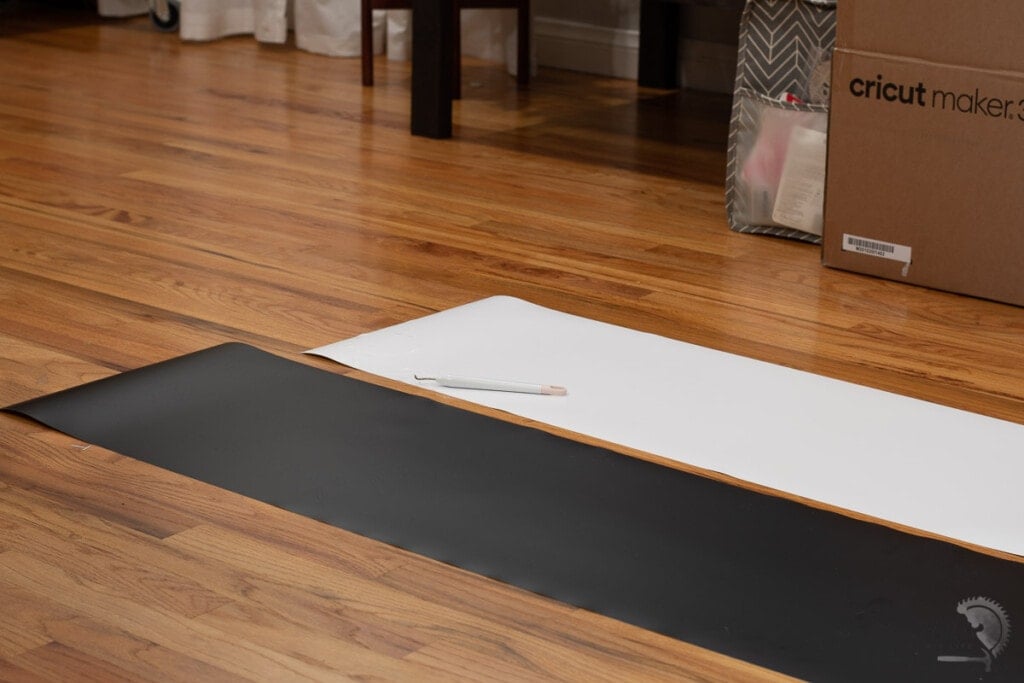 Long black and white vinyl cuts on the floor.