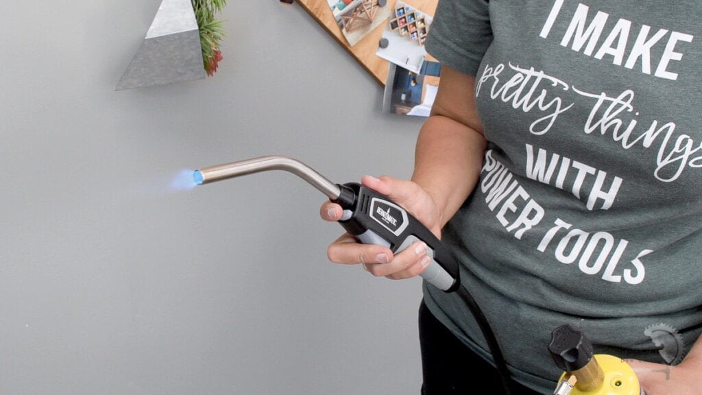 Woman using a blowtorch