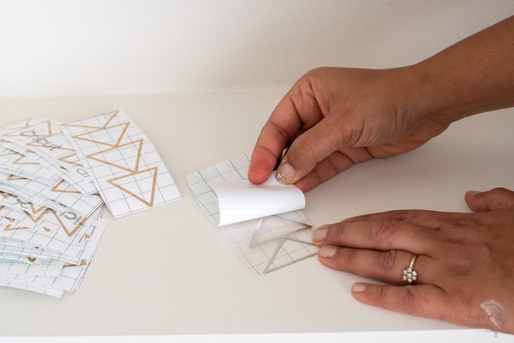 Removing the backing and transferring design on to transfer tape