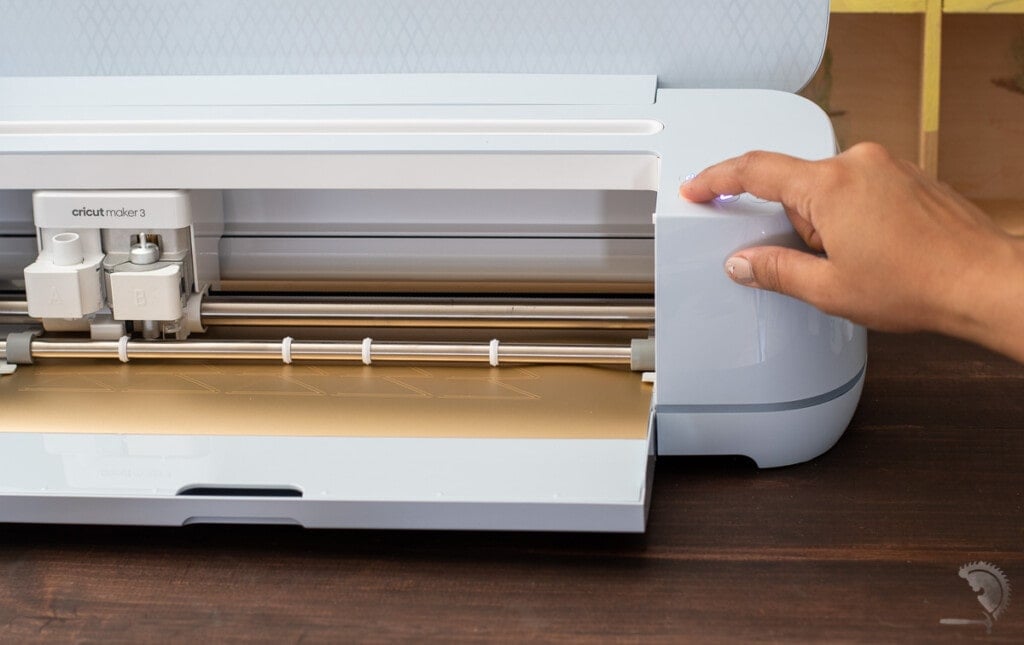 Woman unloading the vinyl from Cricut Maker 3