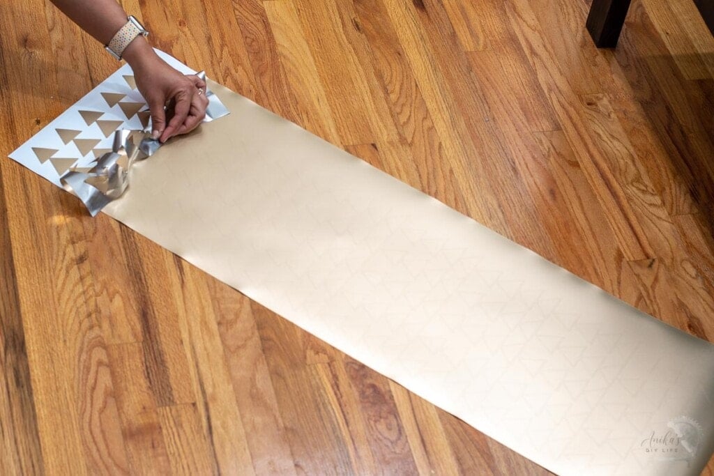 Woman starting to weed the vinyl