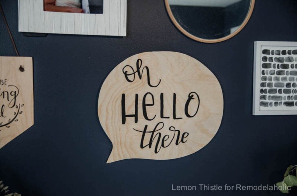 sign made from scrap plywood in shape of speech bubble