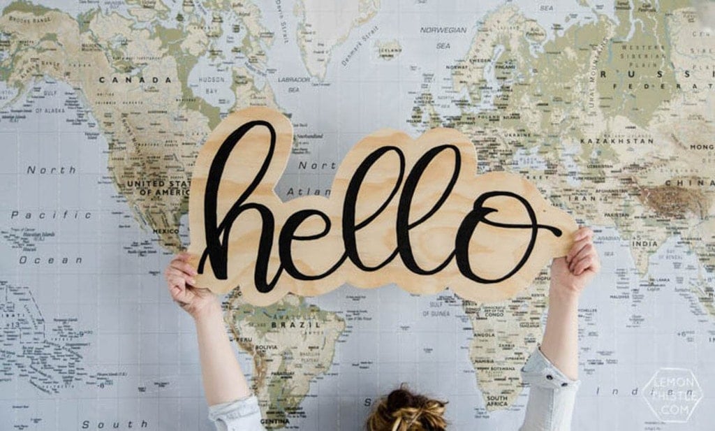 hello sign held up by woman
