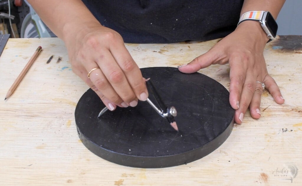 drawing an arc on the circle with a compass