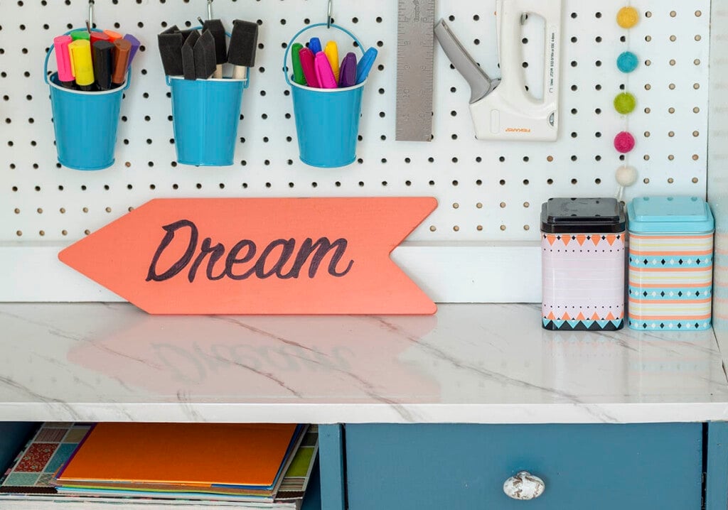 faux marble countertop in craft closet made with marble contact paper