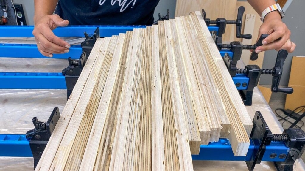 glueing up plywood strips with 45-degree stagger to make patterned plywood