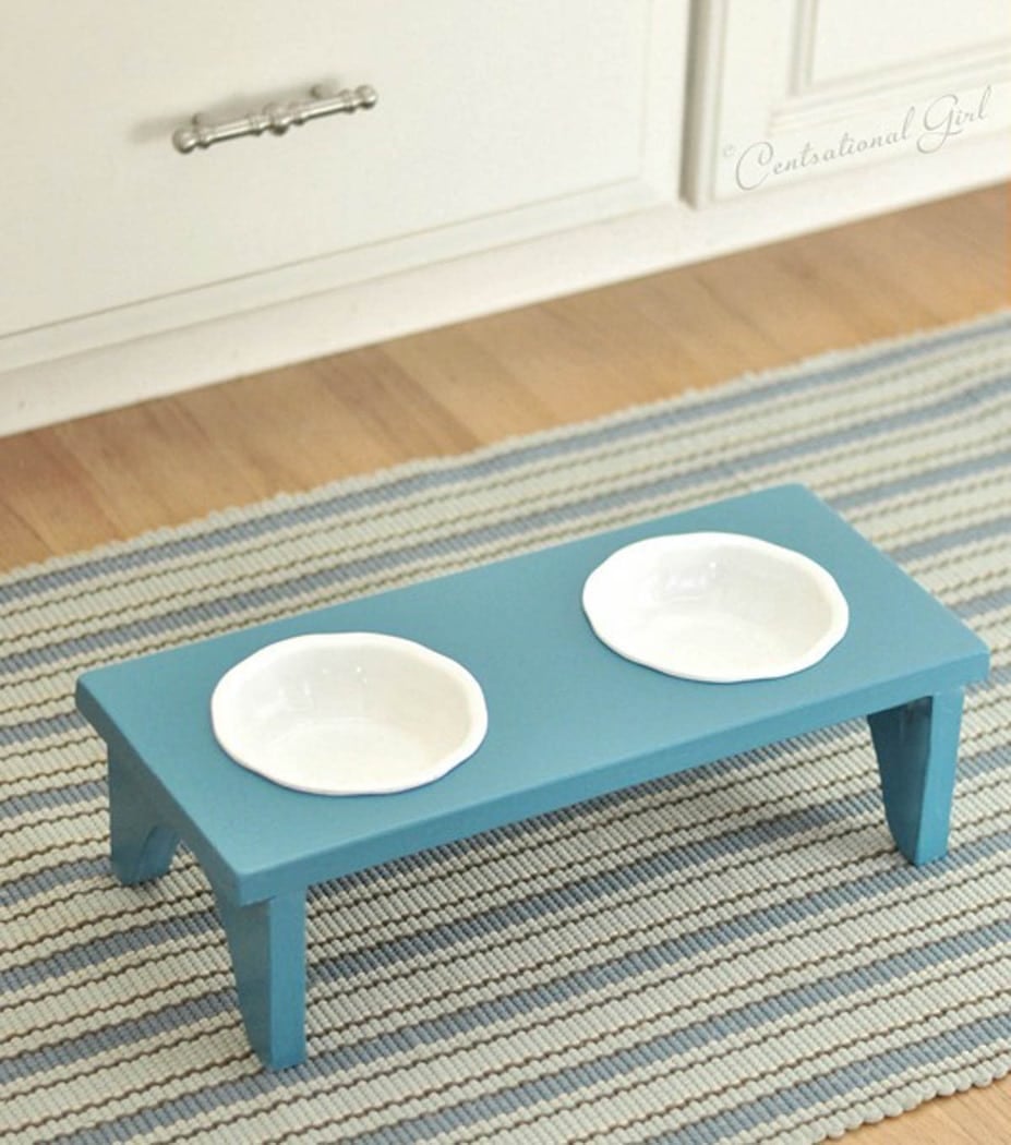 blue dog bowl stand with white bowls