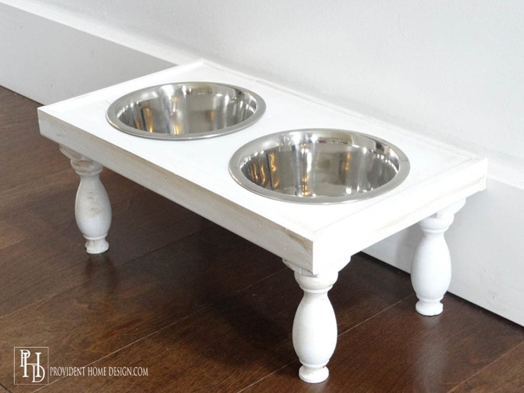 white dog bowl stand with turned legs