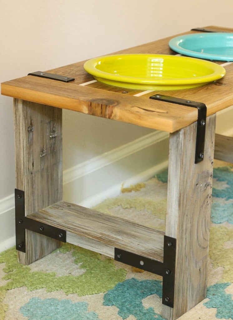 dog bowl feeder with yellow and teal bowls and metal accents
