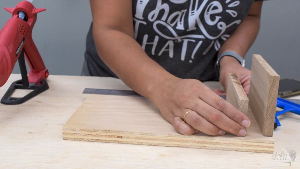 woman adding boards to support devices while they charge