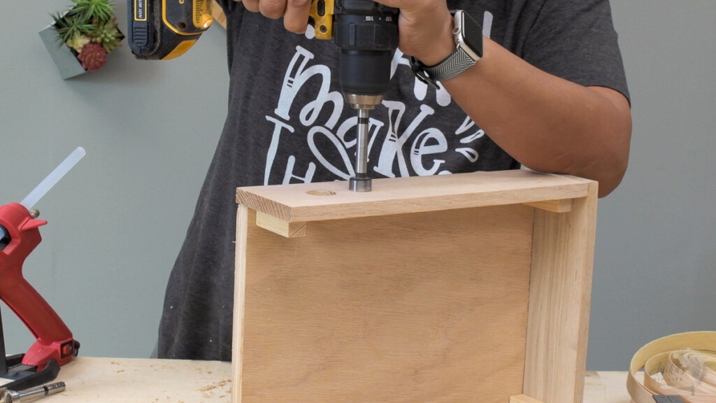 Making holes to pull out wires in the charging station