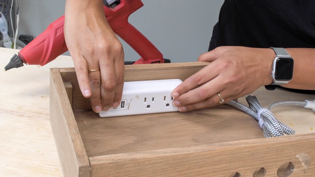 attaching power strip inside the charging station