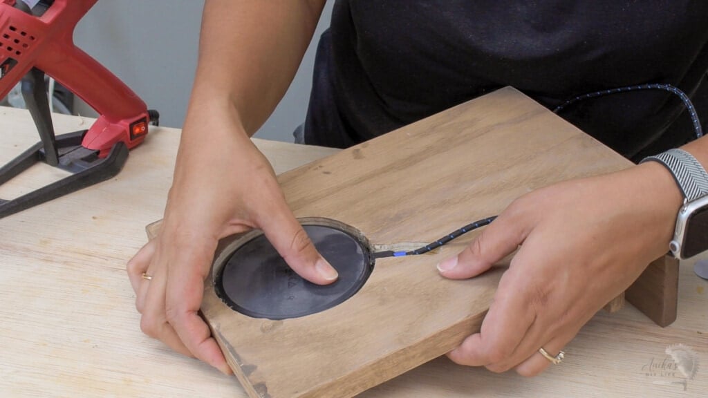 Attaching wireless charger inside the top of the charging station