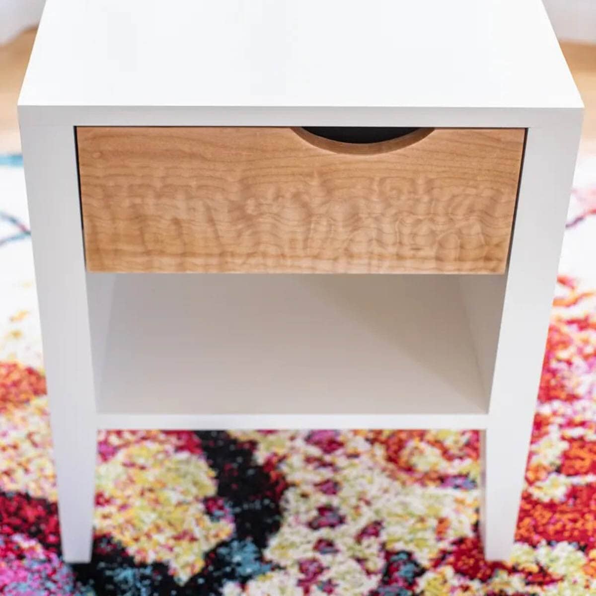 white nightstand with natural colored drawer