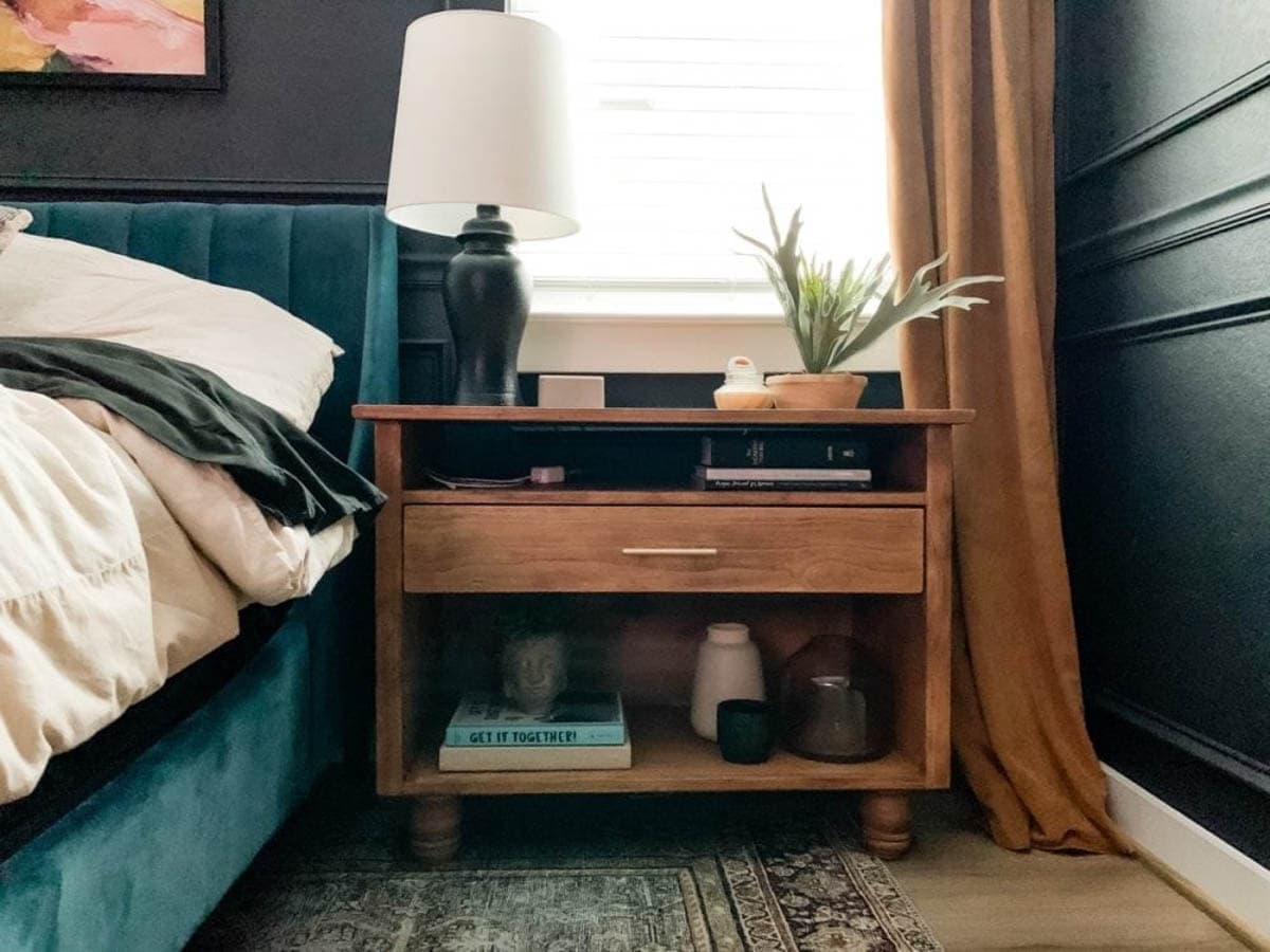 dark stained nightstand with turned feet