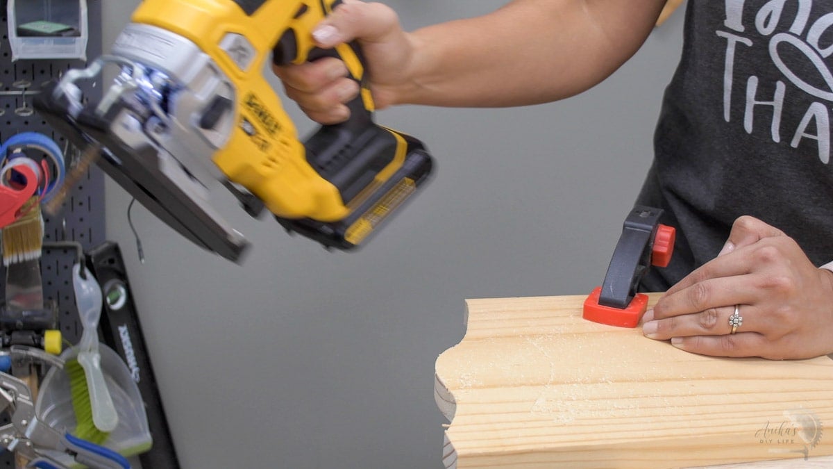 Woman cutting curves on a jigsaw