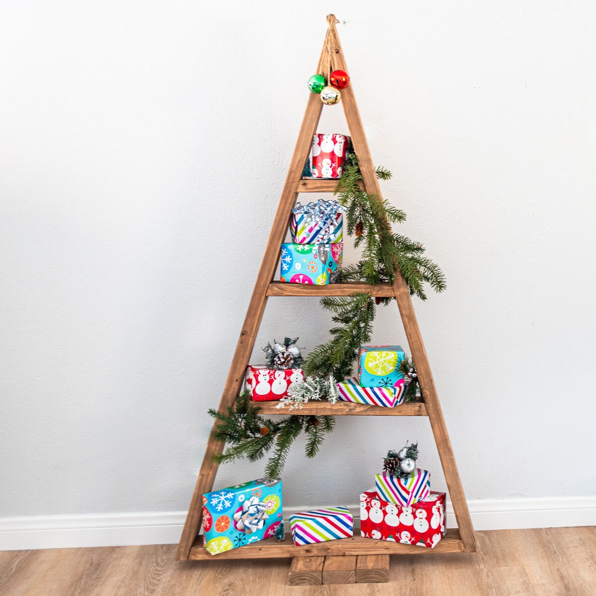 Learn how to build an easy DIY Christmas tree shelf in a couple of hours with this simple step-by-step tutorial.