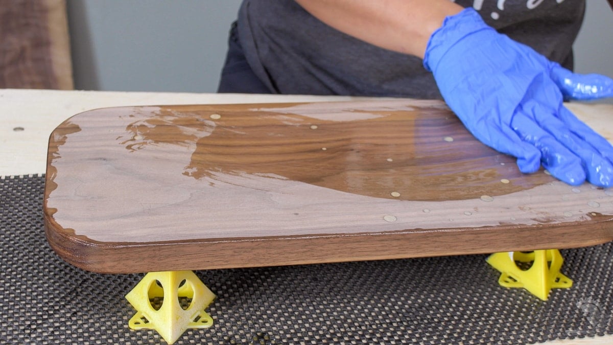 applying cutting board oil to the board