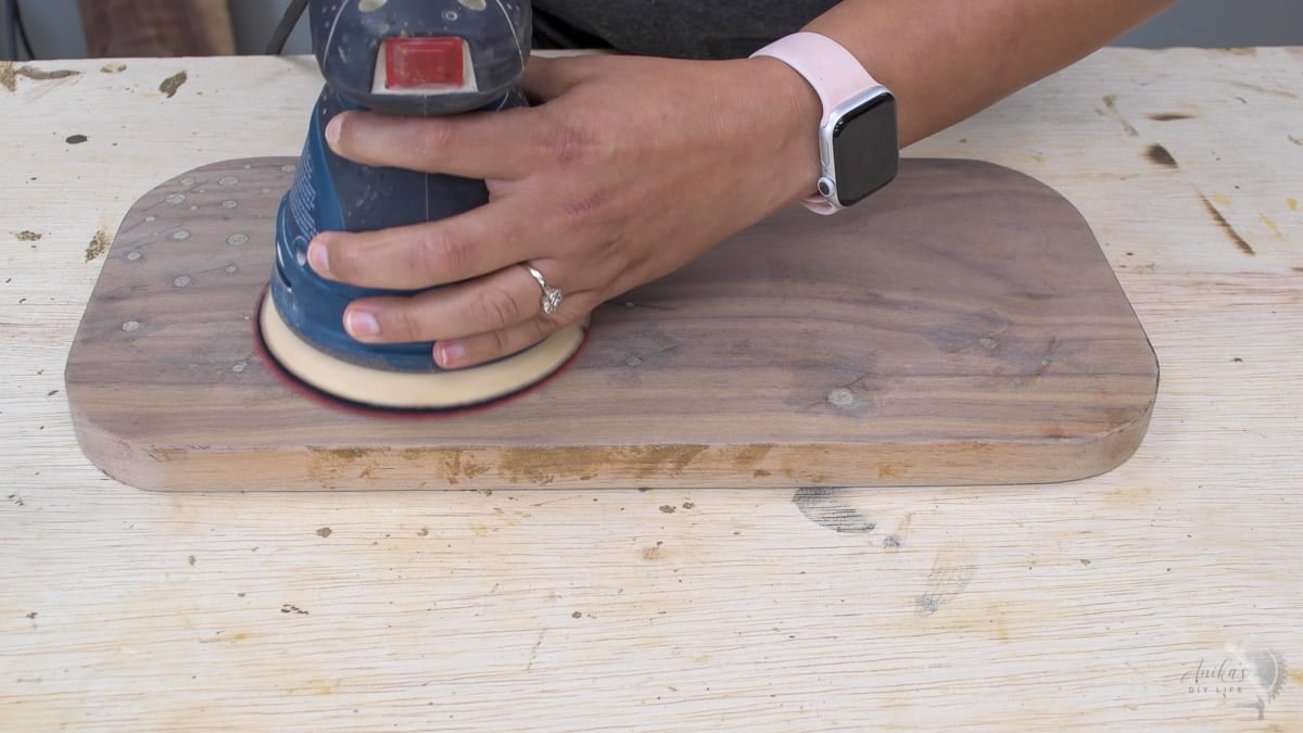 Sanding walnut cutting board