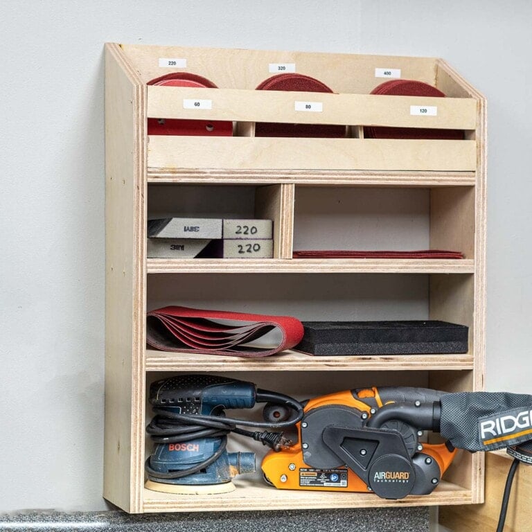 Sandpaper and sander storage on wall