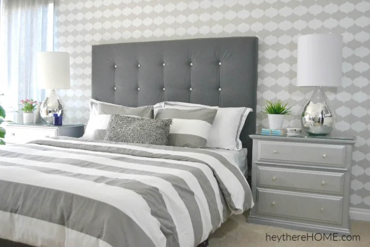 gray fabric headboard with tufting