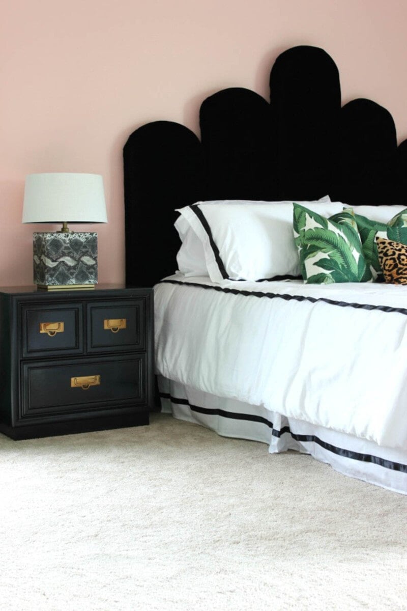black upholstered Hollywood Regency style headboard