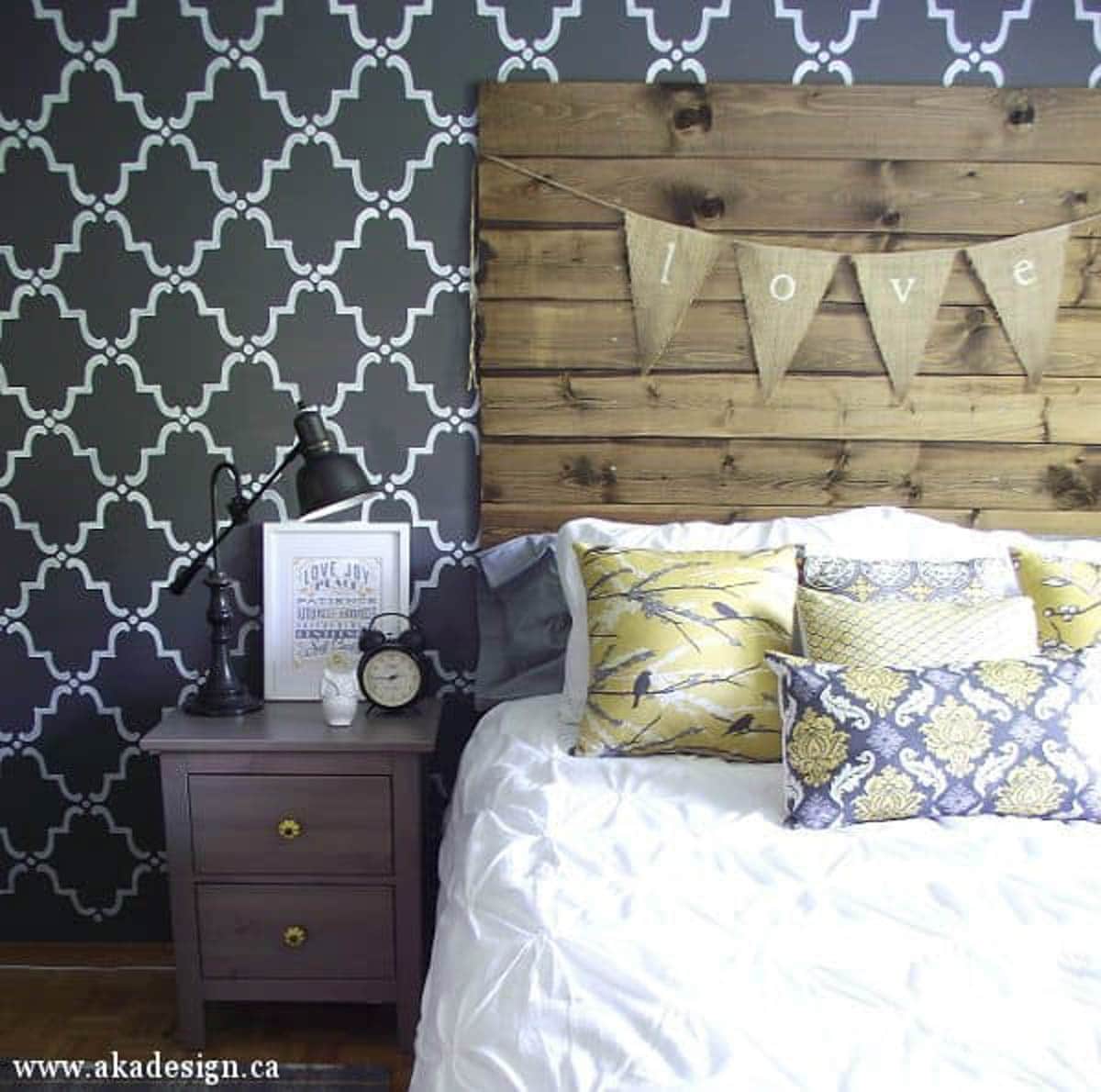 wood headboard with burlap pennant hanging on it