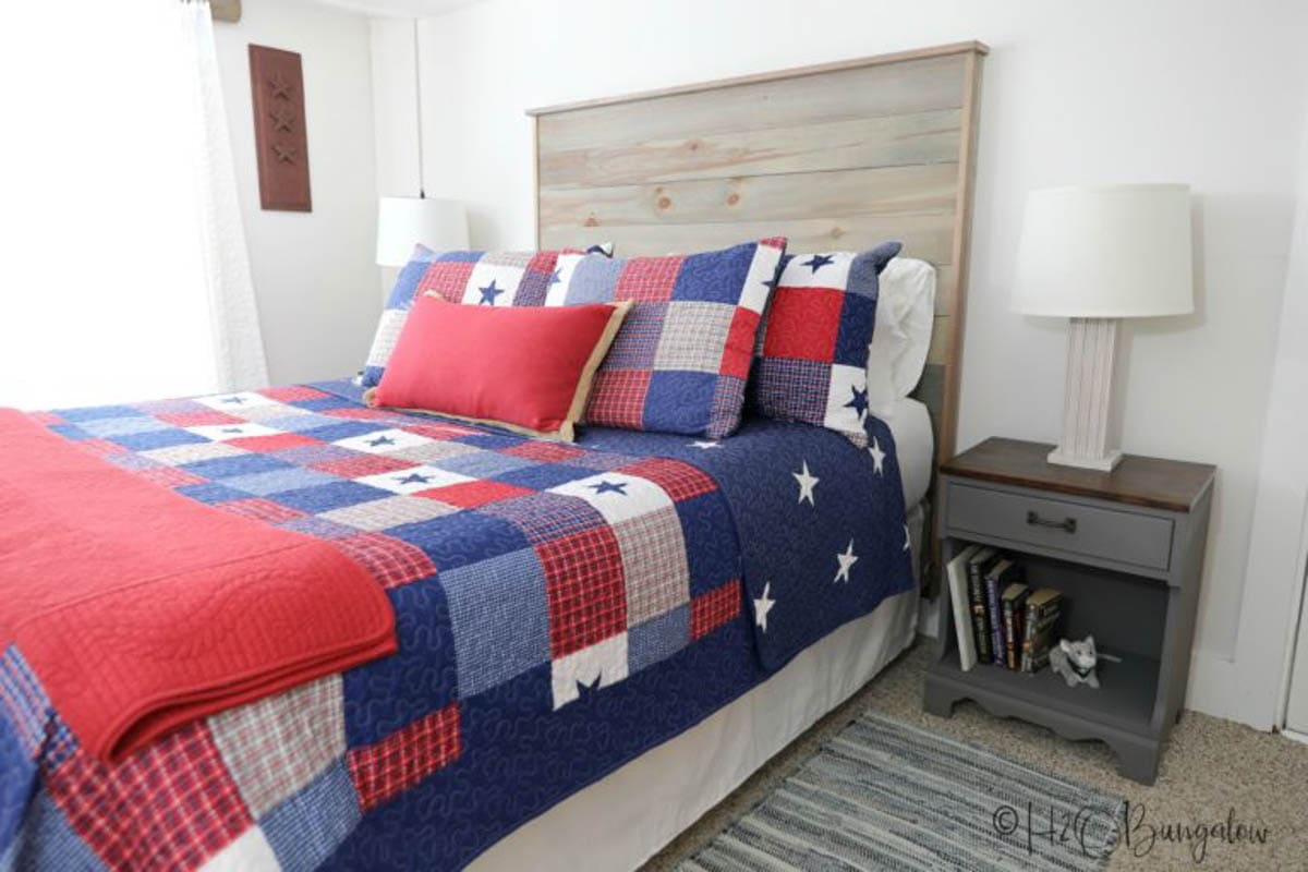 shiplap headboard with red white and blue quilt bedding
